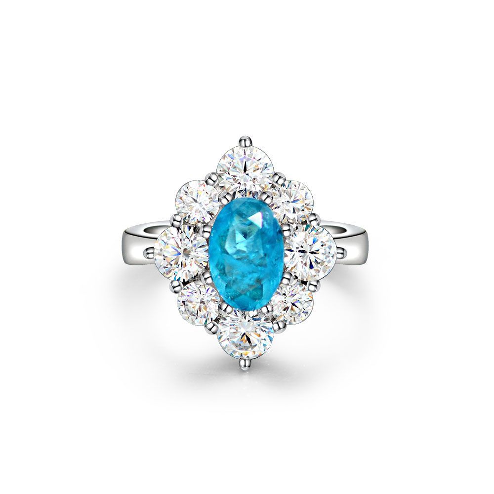 Oval shaped Paraíba blue sapphire set with Amazing Crystals in a 925 sterling silver halo Ring