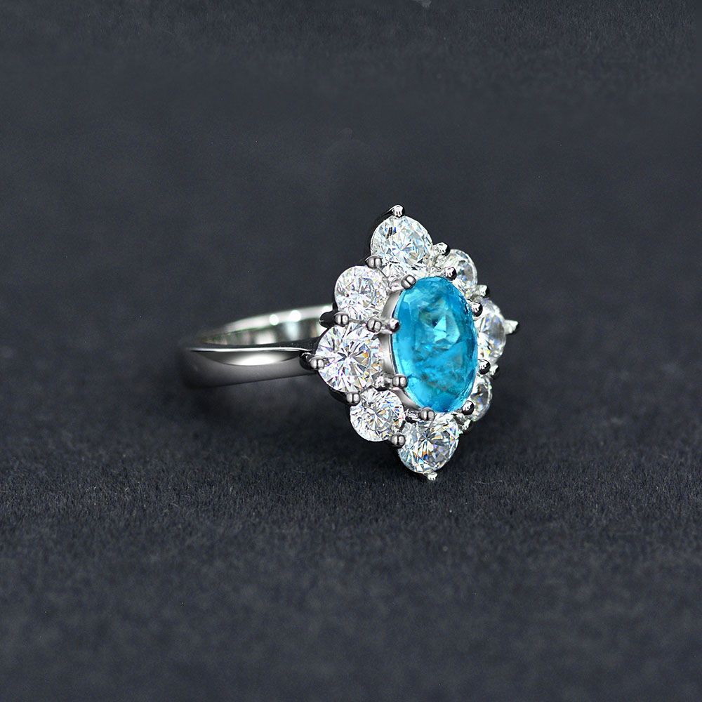 Oval shaped Paraíba blue sapphire set with Amazing Crystals in a 925 sterling silver halo Ring view 3